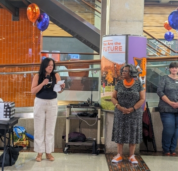PSC Chair Kari D'Amico speaking at Summerfest